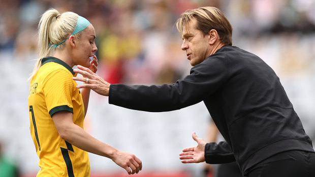 Matildas head coach Tony Gustavsson speaks with Ellie Carpenter during the 3-0 loss on Saturday.