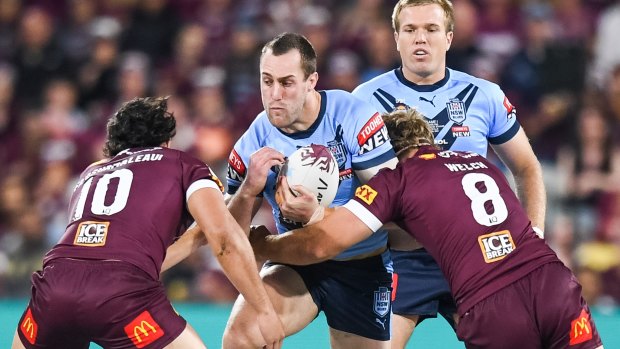 Isaah Yeo charges into the Queensland defence during the State of Origin series opener.