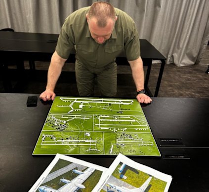 Head of the Security Service of Ukraine (SBU) Vasyl Malyuk examines diagrams after SBU’s special operation in Ukraine on Sunday.