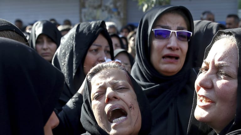 Families of victims of Saturday's terror attack on a military parade in the southwestern city of Ahvaz, that killed 25 people mourn at a mass funeral ceremony, in Ahvaz, Iran.  A Norwegian citizen of Iranian descent was arrested on suspicion of helping an unspecified Iranian intelligence service "to act in Denmark” against the Arab Struggle Movement for the Liberation of Ahwaz, blamed for the terror attack in Ahvaz.