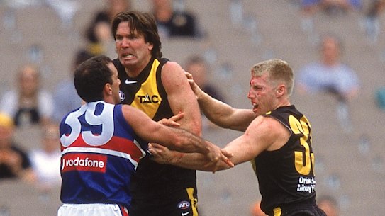 Wayne Campbell ‘flies the flag’ for teammate Matthew Knights in 2001. 