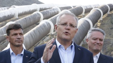 Minister for Energy Angus Taylor, the Prime Minister and Minister for Finance and the Public Service Mathias Cormann at the Snowy Hydro Tumut 3 power station. Morrison has threatened to have the government-owned Snowy Hydro power company build a gas plant should private enterprise not step in and do it themselves.