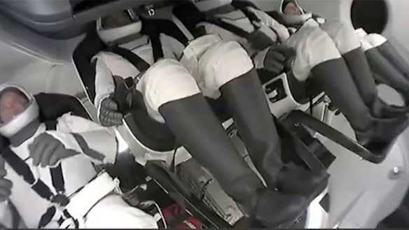 The crew aboard SpaceX’s first private flight as it blasts off.