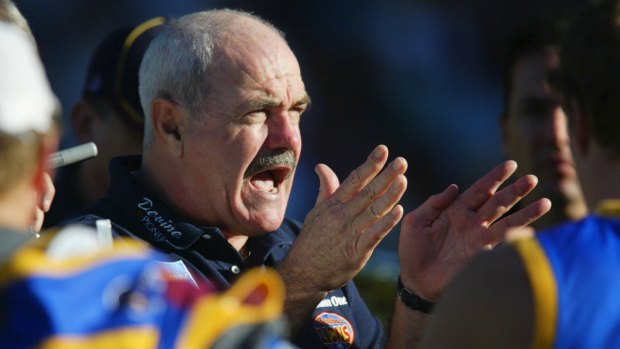 Hawthorn icon Leigh Matthews coaching Brisbane players in 2002. 