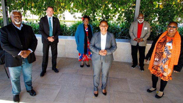 Member for Cook Cynthia Lui (front row, centre) with Minister for Aboriginal and Torres Strait Islander Partnerships Craig Crawford (back row, left) with Torres Strait Islander representatives in Brisbane on Thursday.