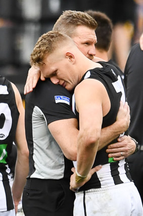 Shattering: Nathan Buckley and Adam Treloar after the game.