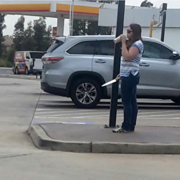 The infamous photo of Courtney with the knife outside Hungry Jack's: 'To be remembered like that is awful,' says her brother Kris.
