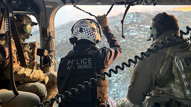 After three weeks, travel warning lifted as police continue search for suspected cop killer
