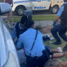 Police render first aid to shooting victim David Khou.