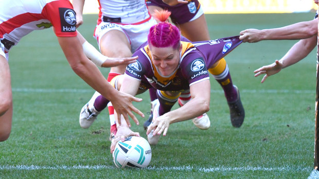 In the pink: Chelsea Baker scores for the Broncos in their opener against St George Illawarra on Sunday.