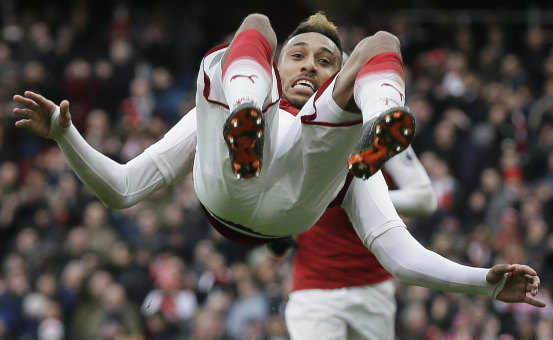 Arsenal's Pierre-Emerick Aubameyang celebrates after scoring a penalty against Stoke at the Emirates on Sunday.