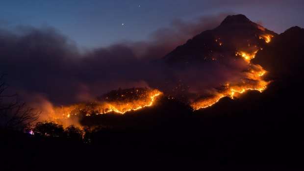 A "glowing ribbon of fire" snaking through Mt Barney National Park. 
