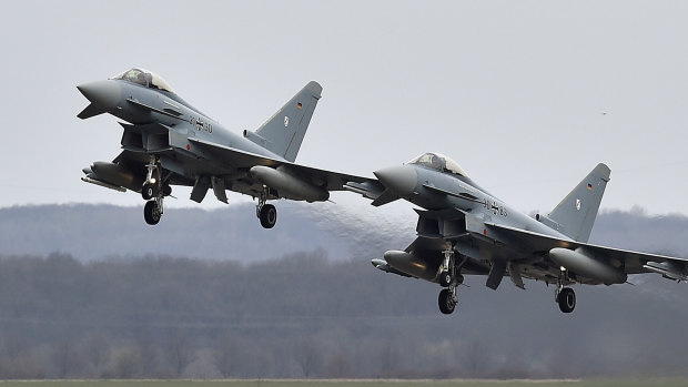 Two Eurofighter jets perform at the German Air Force Base in Noervenich, western Germany.