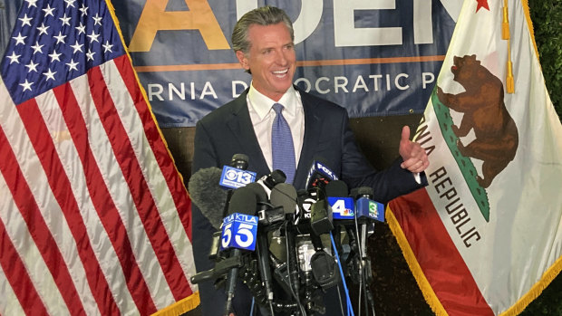 California Governor Gavin Newsom addresses a crowd in Sacramento on Tuesday night, US time.