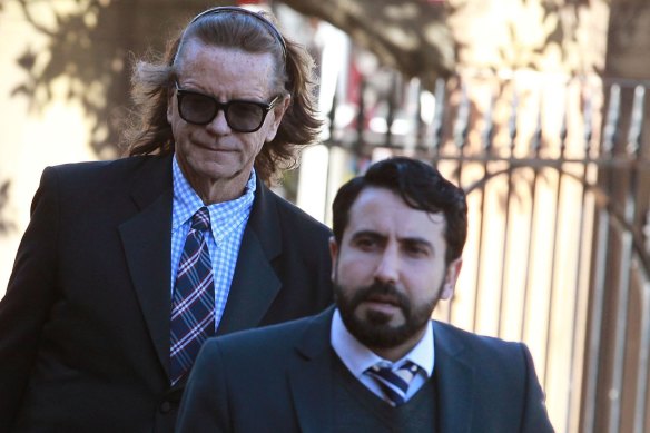 Charles Waterstreet, left, arrives at the murder trial of Roger Rogerson and Glen McNamara in 2015.