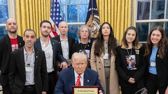 US President Donald Trump with Israeli hostages released from Gaza (from left): Iair Horn, Omer Shem Tov, Eli Sharabi, Keith Siegel, Aviva Siegel, Naama Levy, Doron Steinbrecher and Noa Argamani at the White House.