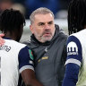 Ange Postecoglou celebrates with his players.