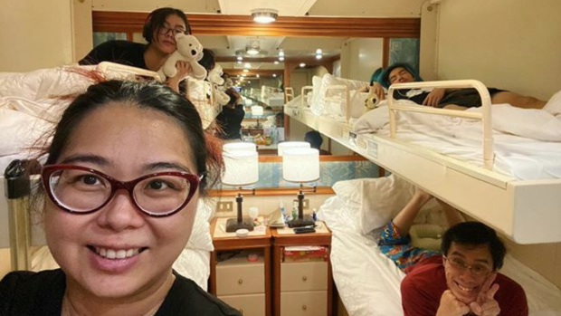 In for the long haul: Australian woman Aun Na Tan and her family in their cabin on board the Diamond Princess, which has been docked in quarantine in Yokohama due to the coronavirus outbreak.