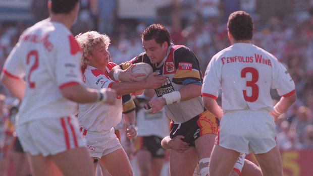 Western Reds star Mark Geyer charges into St George’s Nathan Brown at Kogarah Oval in 1995.