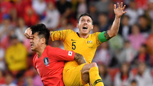 Committed: Mark Milligan lined up at centre back against South Korea in his first game as full-time skipper.