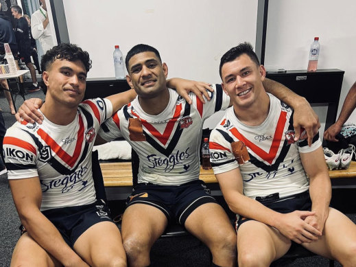 Daniel Tupou (centre) in the sheds with Joseph Suaalii and Joey Manu after breaking the Roosters’ try-scoring record.