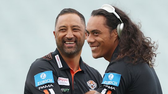 Jarome Luai shares a joke with Tigers coach Benji Marshall.