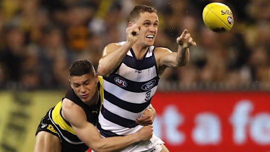 Joel Selwood is tackled by Tiger Dion Prestia during last year's preliminary final against Richmond.