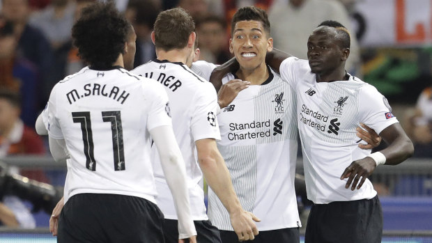 Just did enough: Mo Salah, James Milner, Roberto Firmino and Sadio Mane celebrate Liverpool's opening goal.
