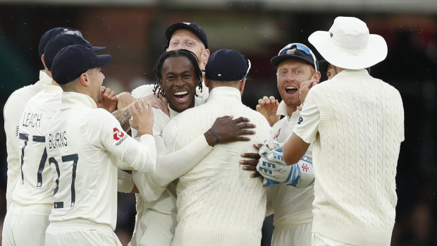 Jofra Archer, centre, celebrates after taking the wicket of Cameron Bancroft.
