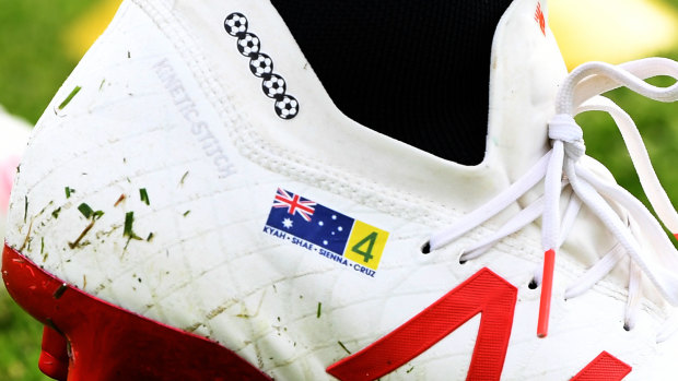 Feet first: Tim Cahill's personalised boots for the World Cup.