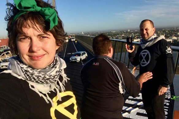 Coco (left), Zammit and Homewood (right) atop the West Gate Bridge on Tuesday.