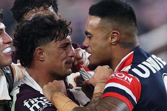 Spencer Leniu (right) of the Roosters exchanges heated words with Kotoni Staggs of the Broncos.