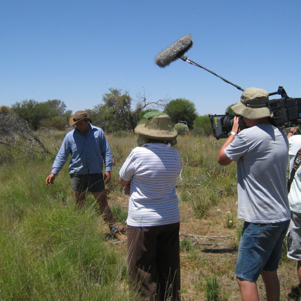 Pollock tries to pass on his passion for perennial grass to a TV film crew. 