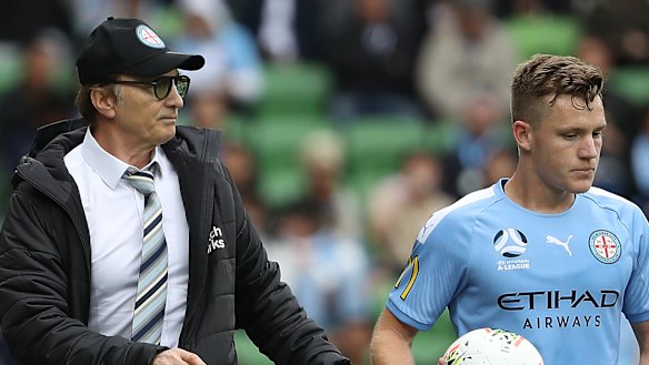 Melbourne City coach Erick Mombaerts, left, speaks to Scott Galloway.