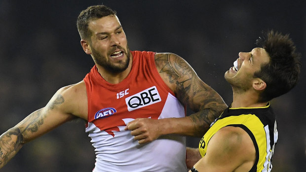 Stars collide: Richmond's Alex Rance is rocked by an elbow from Sydney's Lance Franklin.