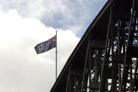 The Queensland flag flying above the Sydney Harbour Bridge in 2001, after yet another Maroons State of Origin victory. But would anyone have noticed?