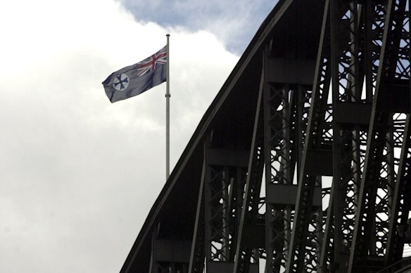 The Queensland flag flying over the Sydney Harbour Bridge following an earlier premiers’ State of Origin bet.
