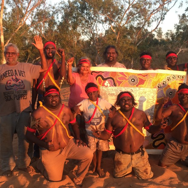 Thomas Mayor (far left) takes the Uluru Statement canvas to the Yule River Bush meeting in the Pilbara.