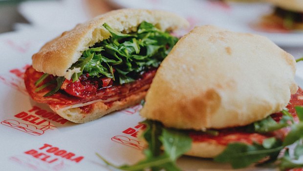 A house-baked puccia with hot salami, provolone, semi-dried tomatoes, rocket and chilli at Tooradeli.