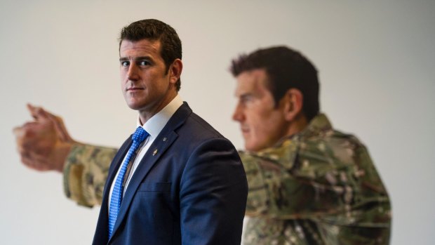 Ben Roberts-Smith in front of his portrait at the Australian War Memorial in Canberra. 
