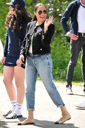Day Two saw Meghan wear an ultra-conservative Celine jacket with a gilt-chained Celine bag, demure Chanel pumps and a pair of low-rise jeans by Moussy Vintage.   