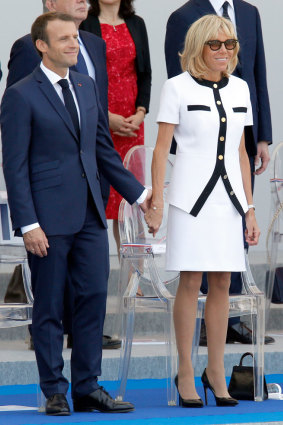 President Emmanuel Macron and his wife Brigitte Macron attend the traditional Bastille Day military parade in 2018.