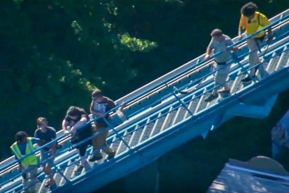 Passengers are evacuated from the roller coaster after the incident in Georgia.