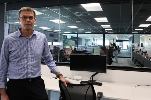 David Brooker in front of the control room monitoring more than 20,000 kilometres of pipe.