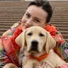 Molly Burke with four-month-old future guide dog, Valentina.