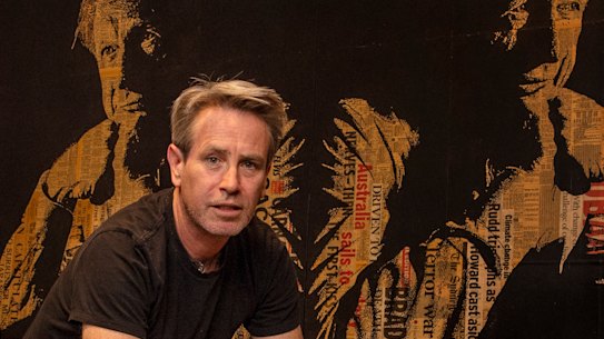 Artist James Powditch with his portrait of Kerry O’Brien. 