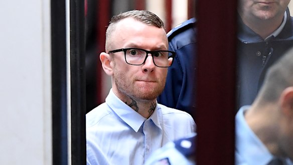 Jesse Vinaccia is led into court.