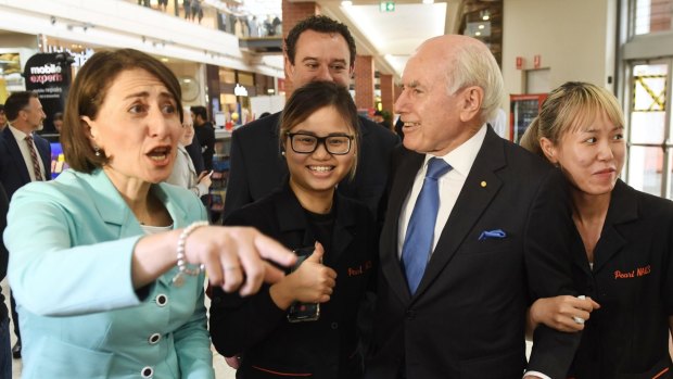 A changing of the guard ... NSW Premier Gladys Berejiklian campaigning with former prime minister John Howard in key battle ground Penrith this week.
