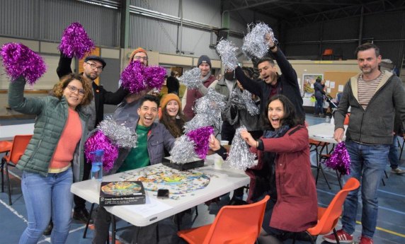 A cheer squad supporting a puzzle team at the South Australian state Jigsaw puzzle competition in 2021.
