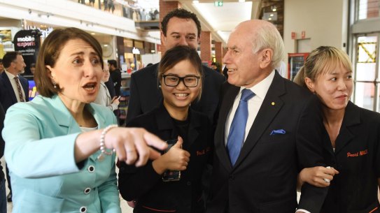 NSW Premier Gladys Berejiklian is joined by former prime minister John Howard as they take to streets in Penrith on Monday.